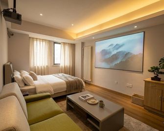 Qingdao Hong Ding Yijia Holiday Apartment - Qingdao - Bedroom