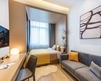 base-Sanlitun Serviced Apartment - Pechino - Camera da letto