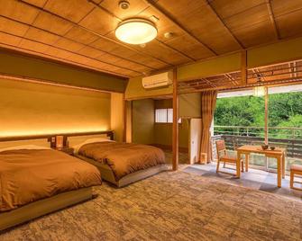 Ooedo Onsen Monogatari Premium Yoshinoya Irokuen - Kaga - Schlafzimmer