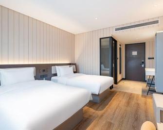 Hanting Hotel Jiaozhou Jiaodong International Airport - Qingdao - Bedroom