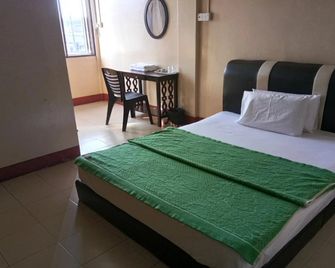 History Hotel - Kangar - Slaapkamer