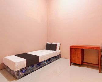 Hotel O Guesthouse Alun Alun Purwokerto - Purwokerto - Schlafzimmer