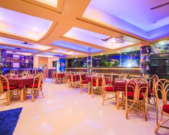 Capital O 22969 The Center Court - Varca - Restaurante