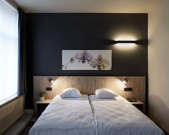 Alpha Hotel and Aparthotel - Tienen - Спальня