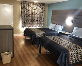 Luxury Inn & Suites - יוסטון - חדר שינה