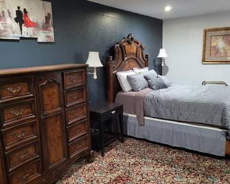 Coratel Inn & Suites by Jasper Hutchinson - Hutchinson - Спальня