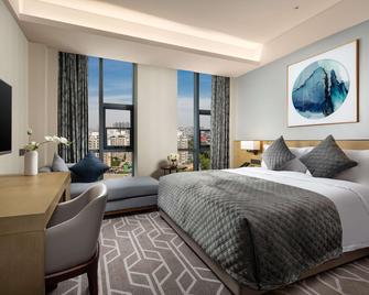 Ramada by Wyndham Luoyang Downtown - Luoyang - Schlafzimmer