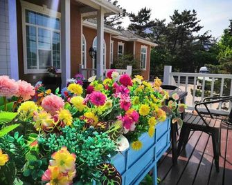 Suiyuan Boutique Hostel - 칭다오 - 침실