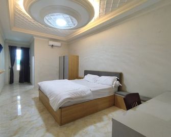 Maulidia Hotel Syariah & Convention Center - Jambi - Slaapkamer