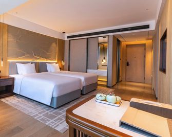 Qinhuang Holiday Hotel (Shaanxi Finance and Economics Vocational College Branch, Wenlin Road) - Xianyang - Bedroom