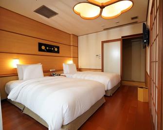 ラジウム 加賀屋 インターナショナル ホテル - 台北市 - 寝室