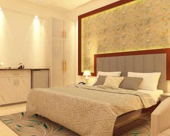 Corbett View Banquets and Resorts - Morādābād - Schlafzimmer