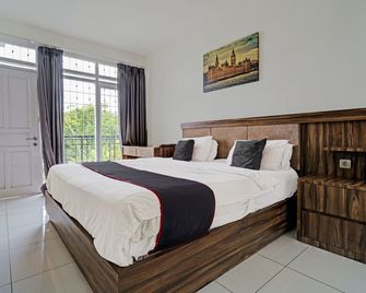 Collection O 92277 Setra Priangan Guest House - Bandung - Schlafzimmer