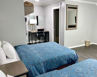 Budget Host Inn - Vernon - Schlafzimmer
