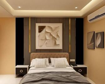 Hotel Golden Continental - Deoghar - Schlafzimmer