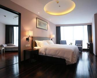 Yiwu Orange Boutique Hotel - Jinhua - Schlafzimmer