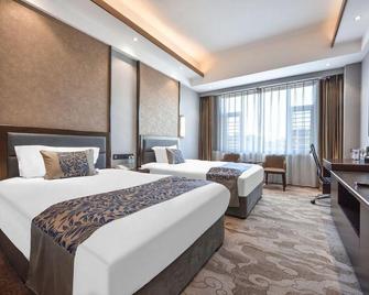 Dandong Rising Zhonglian Hotel - Dandong - Bedroom