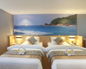 Metropolo Hainan Provincial Government Riyue Duty Free Hotel - Haikou - Slaapkamer