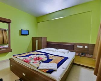 Hotel Rohini International - Digha - Bedroom