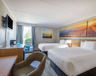 Days Inn & Suites by WyndhamFort Bragg/Cross Creek Mall - Fayetteville - Slaapkamer