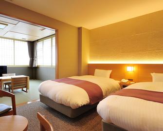 Niseko Hot Spring Ikoino Yuyado Iroha - Niseko - Bedroom