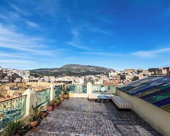 Riad Mounana fez 13th century palace& spa - Fez - Balcón