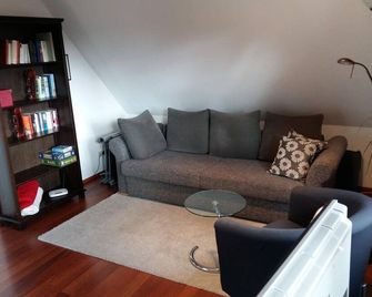 Ferienwohnung Am Schwanensee - Plon - Huiskamer