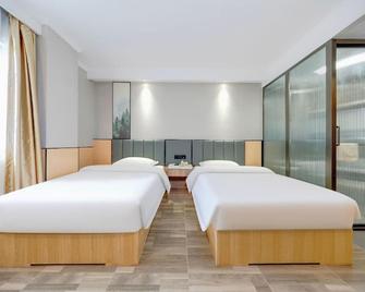 Greentree Inn Jiangsu Nanjing Olympic Sports Center Express Hotel - נאנז'ינג - חדר שינה