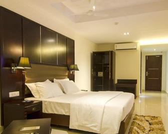 Hotel Thangavilas Inn - 貢伯戈訥姆 - 臥室