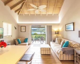 ARIBA - stylish condo w/ ocean views, walk to beach & restaurants in Long Bay - Long Bay - Living room