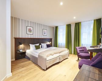 هوتل هوزر - نورمبرغ - غرفة نوم