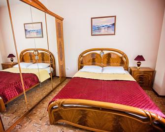 Utomlyonnye Solntsem Hotel - Krasnaja Poljana - Schlafzimmer