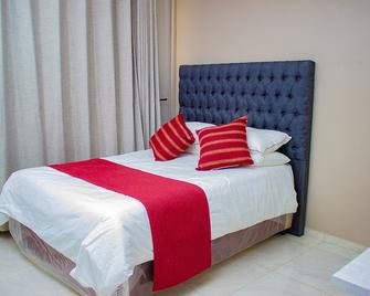 R Executive Apartments - Harare - Schlafzimmer