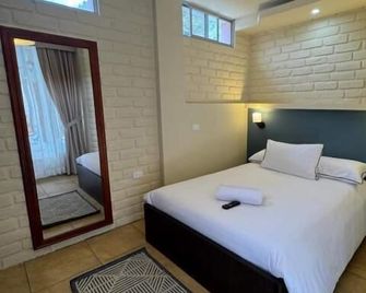 Hotel Casa Agave - Banos - חדר שינה