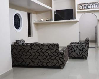 SK Paradise offers accommodation with free WiFi and free private parking.\n\n\n - Palakkad - Living room