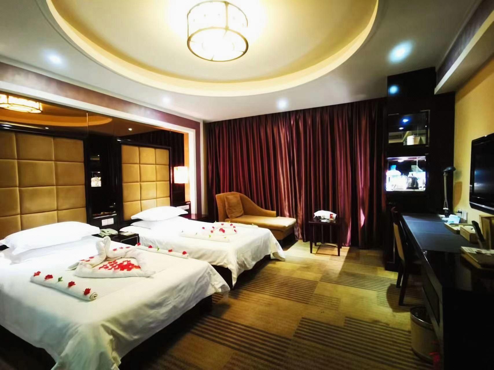 Huangtai International Hotel - ז'ינאן - חדר שינה