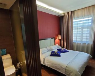 sù 8jiu diàn wu lu mù qí yíng bin lù diàn - Ürümqi - Camera da letto