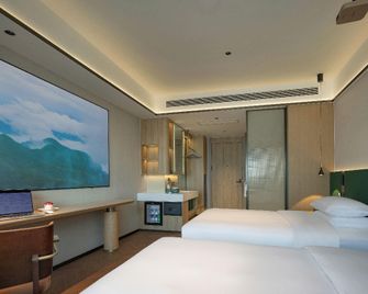 Meiji High-Altitude Audio-Visual Hotel (Jiaozuo High-Speed Railway Station Branch) - Jiaozuo - Slaapkamer