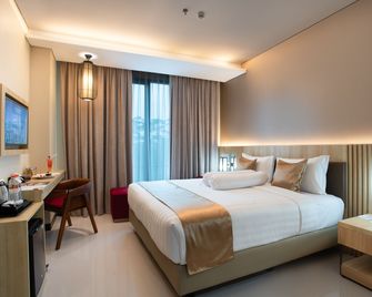 普爾巴靈加阿扎那布拉靈大飯店 - Purbalingga - 臥室