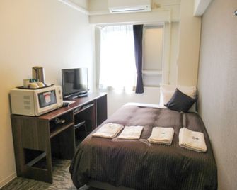 Hotel Livemax Kawasaki Ekimae - קאוואסאקי - חדר שינה