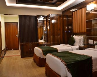 Benzz Park Family Resort Kodaikanal - Kodaikanal - Schlafzimmer