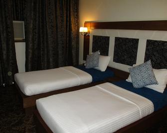 Hotel Sapna - Mumbai - Schlafzimmer
