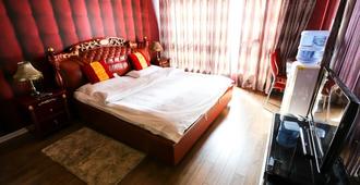 Nissi Holiday Hotel - Kunming - Makuuhuone