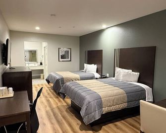 Scottish Inn & Suites - Iah Airport - Humble - Bedroom