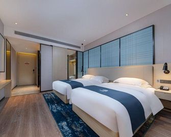Maiduo Garden Hotel (Valley Road Central Square Branch) - Ji'an - Bedroom