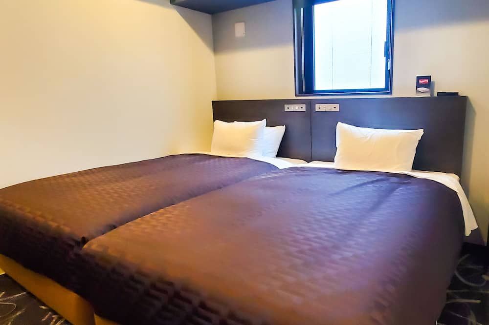 Bedroom view of Hotel Livemax Yokohama Stadium Mae