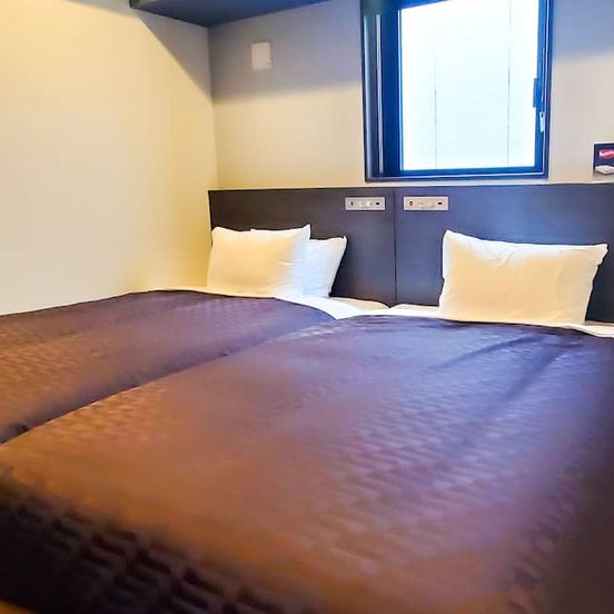 Bedroom view of Hotel Livemax Yokohama Stadium Mae