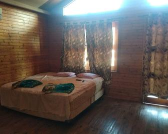 The Wood Beach House - Guhāgar - Habitación