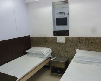 Yadgar Guest House - מומבאי - חדר שינה