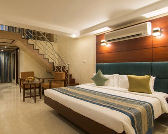Shenbaga Hotel & Convention Centre - פונדיצ'רי - חדר שינה